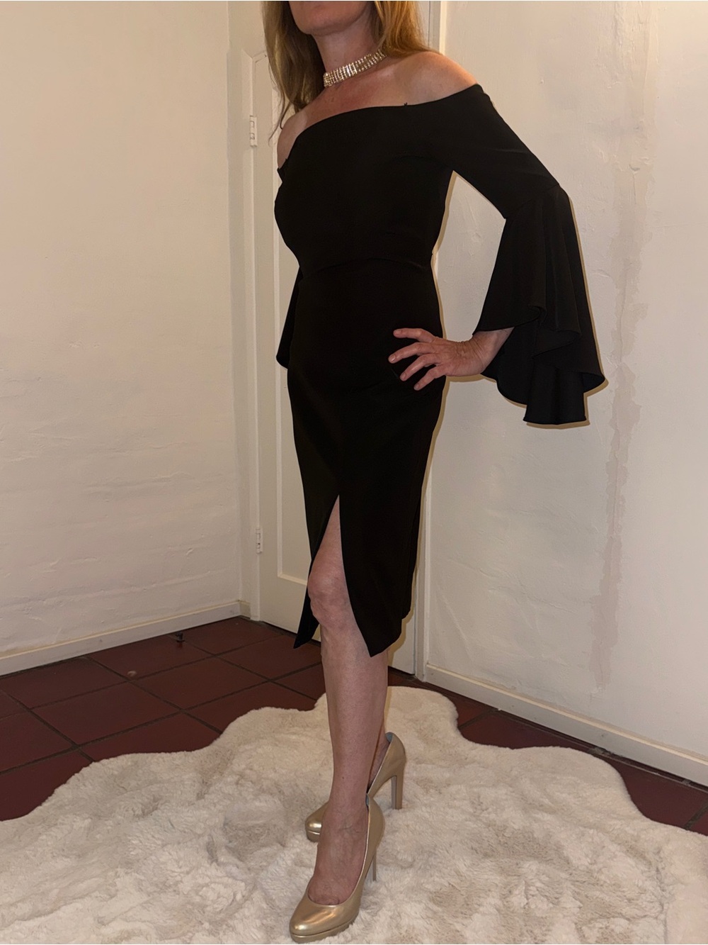 Elegant Off-The-Shoulder Black Midi Dress with Fluted Sleeve